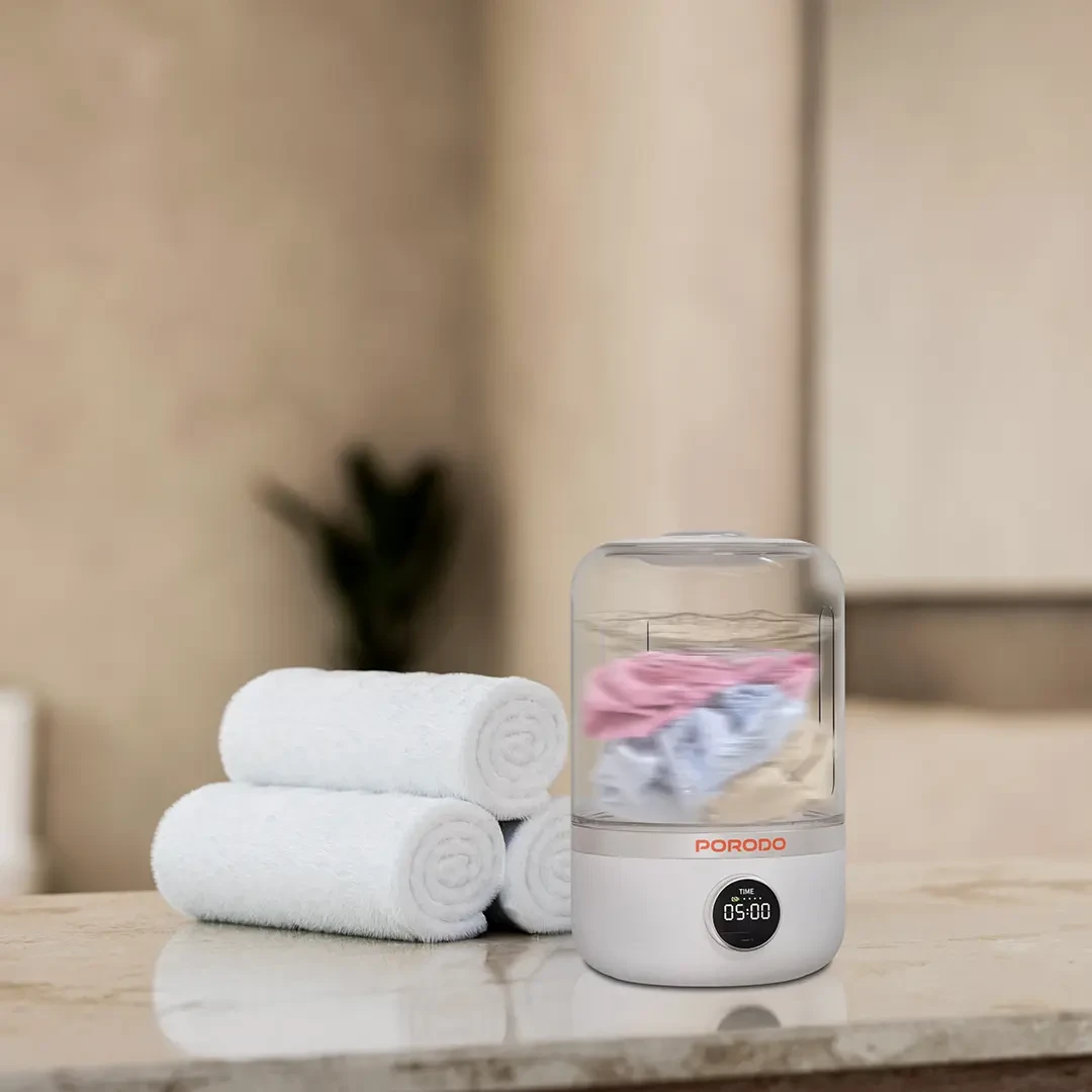3KDc4NUKWuDAxLEhqEkvMfIXLGhqvlFU5a9oeAoq.webp Porodo Cordless Mini Washing Machine 1.2L | LFS192 - White - Image 1